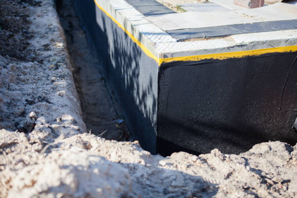Professional Waterproofing technician working in Grand Haven, MI